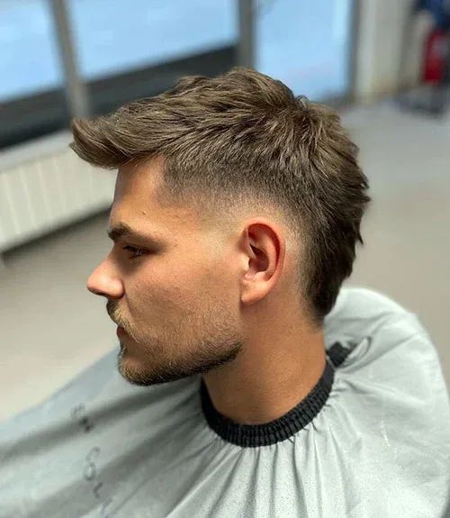 A men in burst Fade haircut